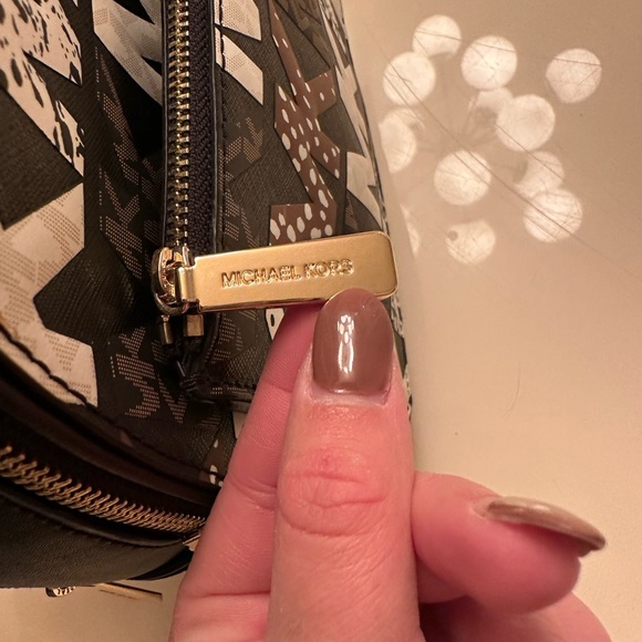 Michael Kors Handbags - Micheal kors animal mini bag that comes with a wallet.
